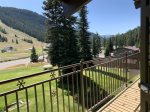 Summer view of balcony, pool, and ski area